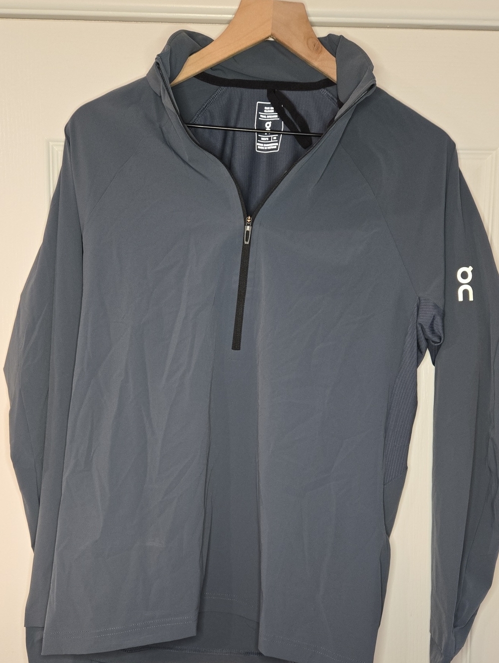 This is an On Running Trail Breaker half-zip top in a grey colorway Size XS